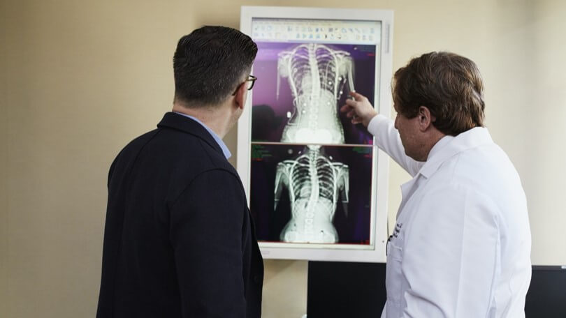 Doctor pointing to chest radiograph