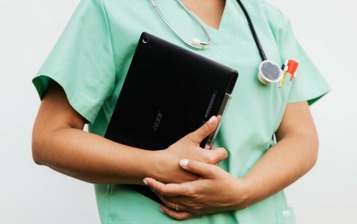 Doctor holding laptop
