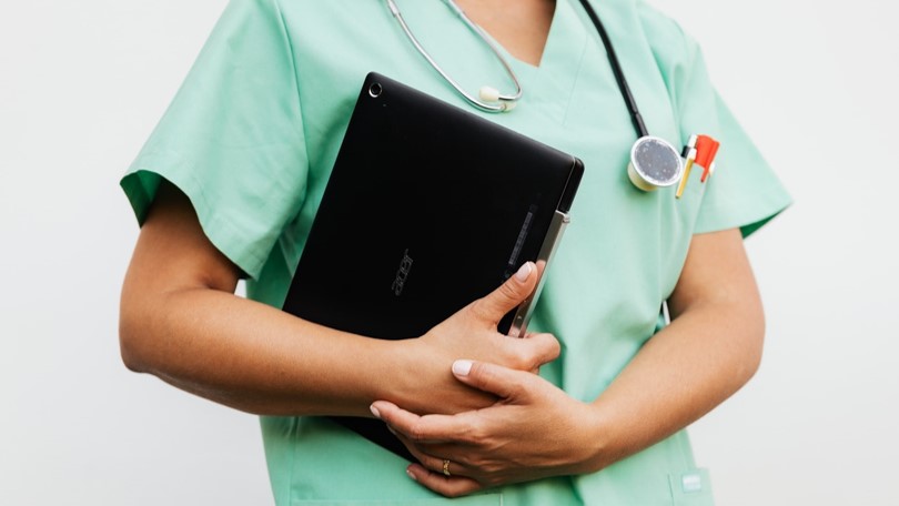 Doctor holding laptop