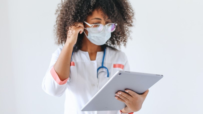 Medical doctor looking at tablet