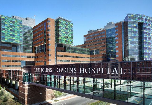 Exterior of a hospital featuring a walking bridge