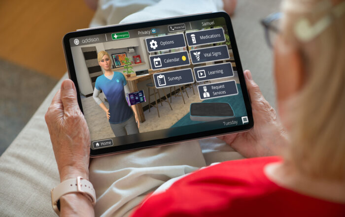 An elderly woman holding a computer tablet during a virtual care session