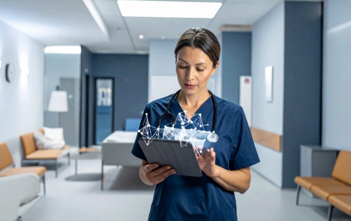 A hospital administrator reviews a tablet displaying an abstract data visualization, representing the opacity of AI-driven clinical decision tools.